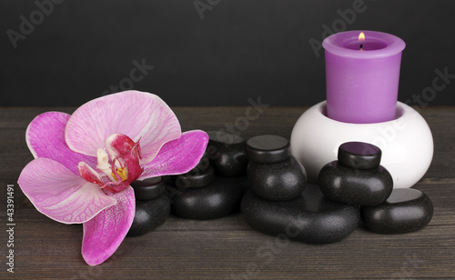 Spa stones with orchid flower and candle