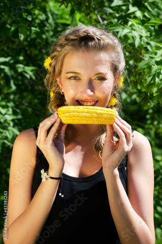 woman eating corn-cob