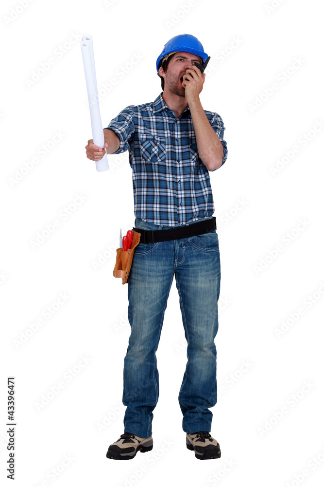 Tradesman screaming into his walkie-talkie Tradesman screaming into his walkie-talkie