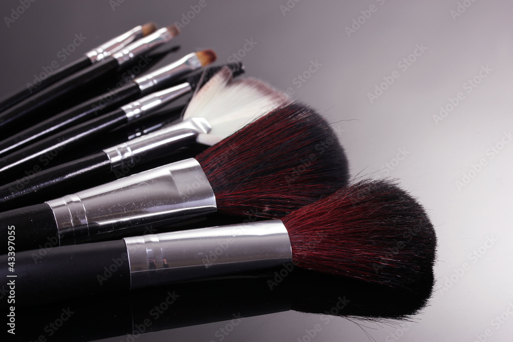 make-up brushes on grey background make-up brushes on grey background