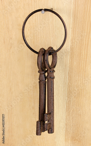 bunch of keys on wooden background