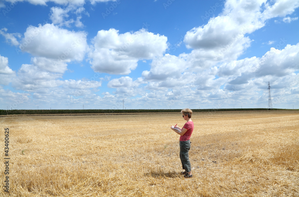 Agronomy expert examine wheat field after harvest Agronomy expert examine wheat field after harvest