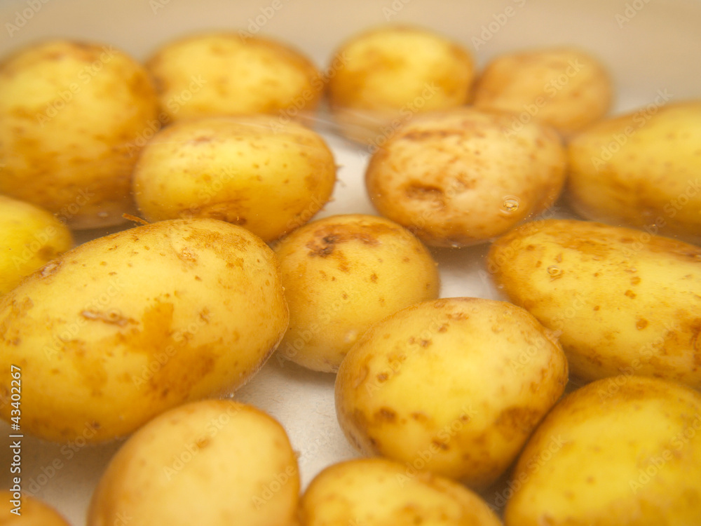 Closeup of potatoes boiling in a kettle Closeup of potatoes boiling in a kettle