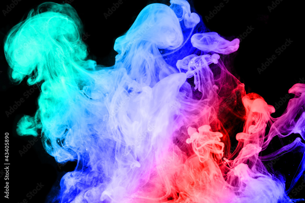 Ink in water on a black background, color gradient. Ink in water on a black background, color gradient.