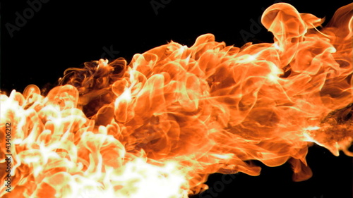 Spray of fire in super slow motion appearing photo