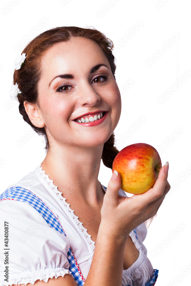 junge brünette Frau im Trachtenkleid mit Apfel junge brünette Frau im Trachtenkleid mit Apfel