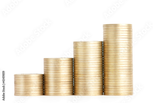 Gold coins stand vertically in columns, isolated on white