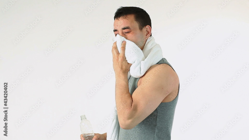 Sportwoman drinking water and breathing