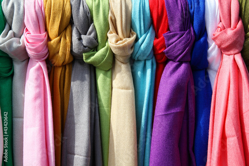 Colorful textiles at a market in Rome, Italy © Tupungato