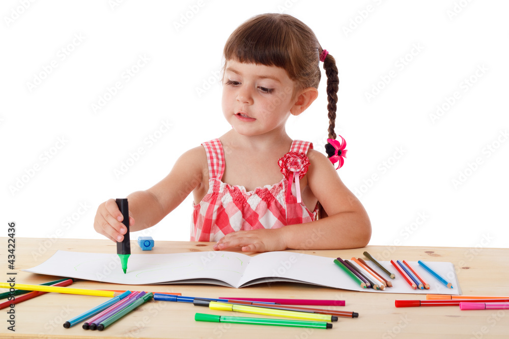 Little girl draw with crayons