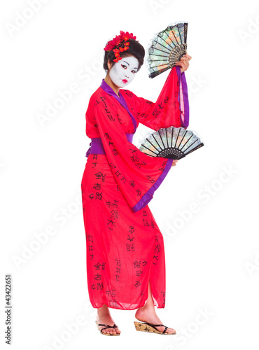Full length portrait of geisha dancing with fans isolated on whi