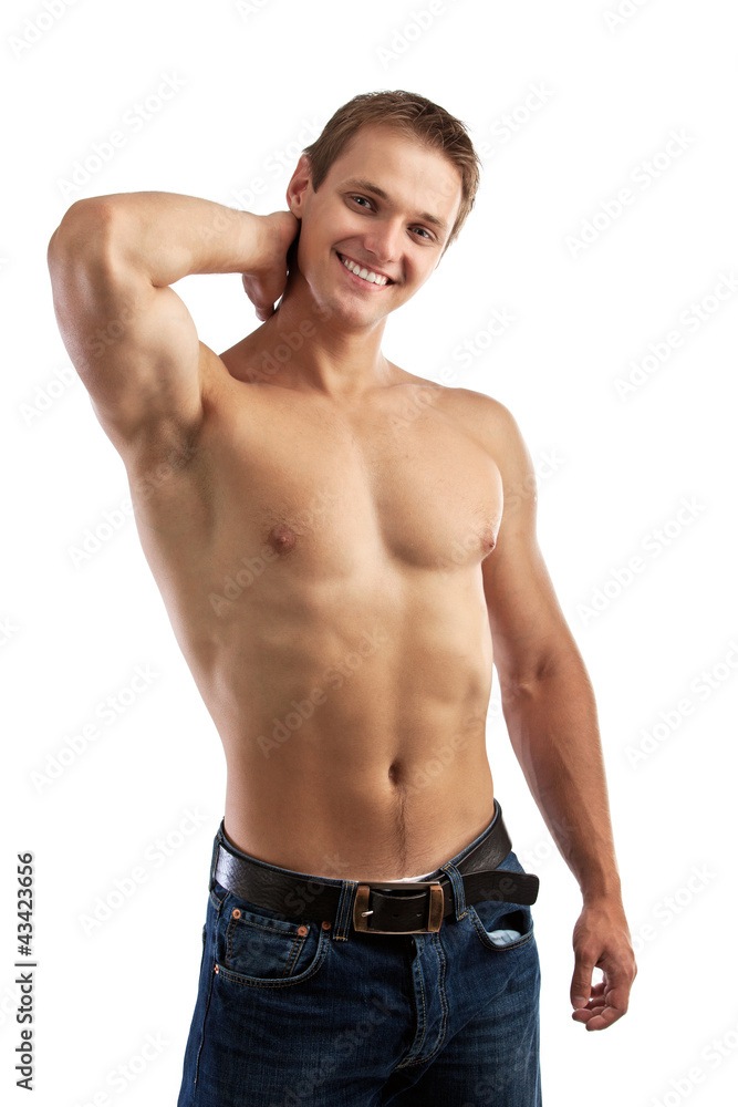 Cheerful young man in jeans with bare torso Cheerful young man in jeans with bare torso