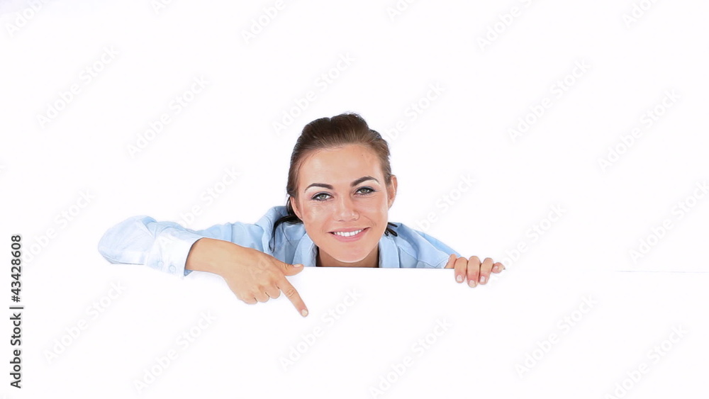 Woman showing her head above a board Woman showing her head above a board