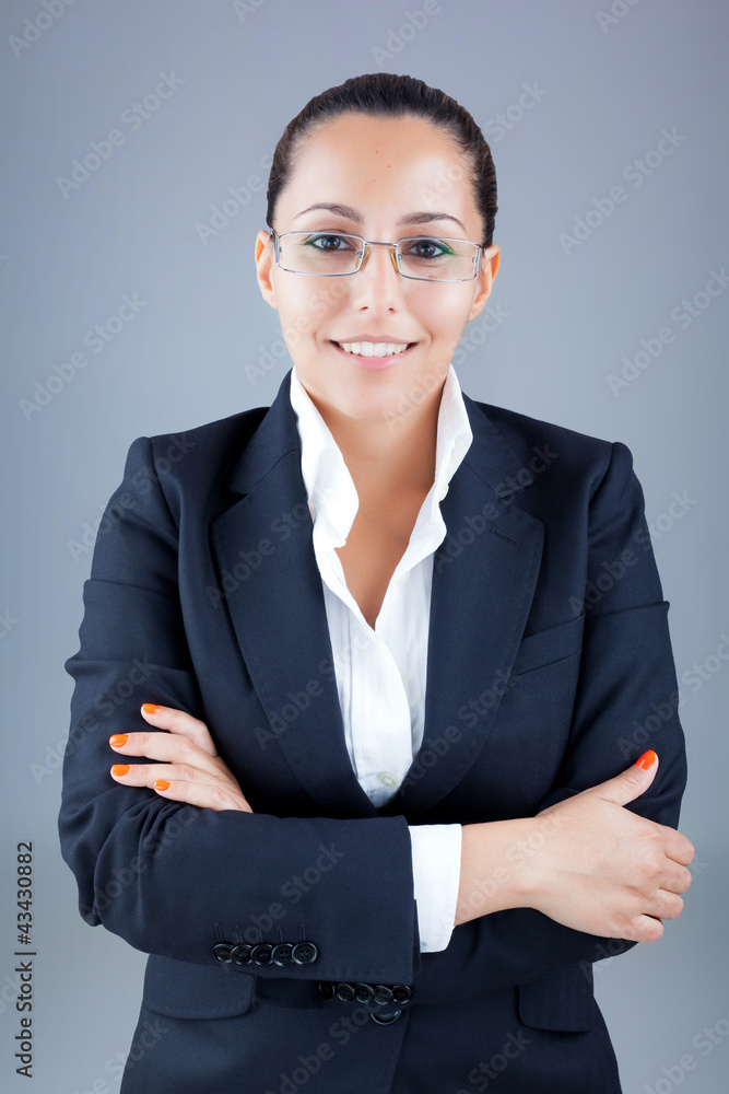 Portrait of beautiful business woman wearing glasses against gre Portrait of beautiful business woman wearing glasses against gre