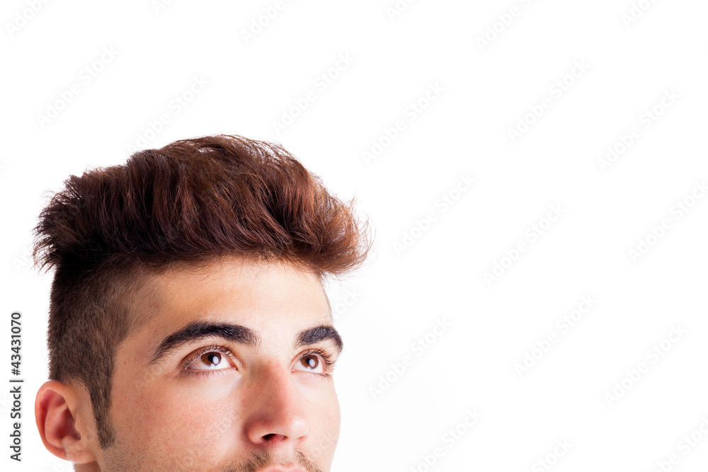 Obraz premium Close-up of handsome young man looking up
