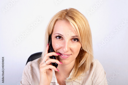 young blonde girl on the phone