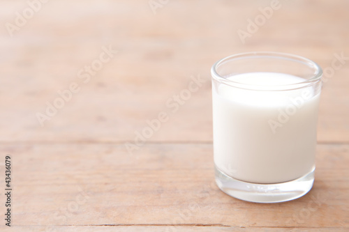 Milk on wood table background