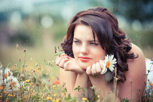 beautiful happy young woman in the park on a warm summer day