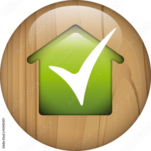 wooden button with green house and ok