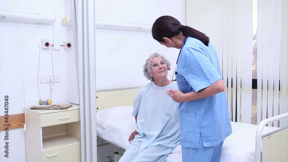 Nurse holding the hand of a patient Nurse holding the hand of a patient