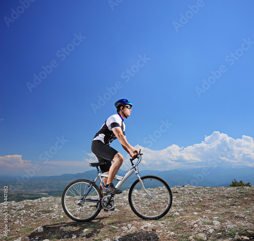 Male bicyclist riding a bike