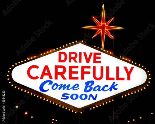 Photography The reverse of the Las Vegas sign reading Drive Carefully