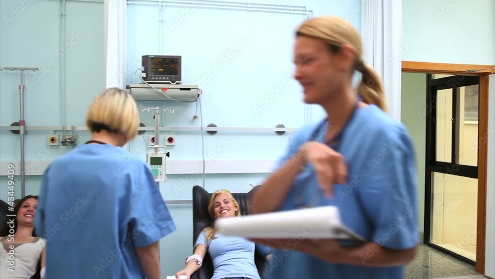 Nurses taking care to patients Nurses taking care to patients
