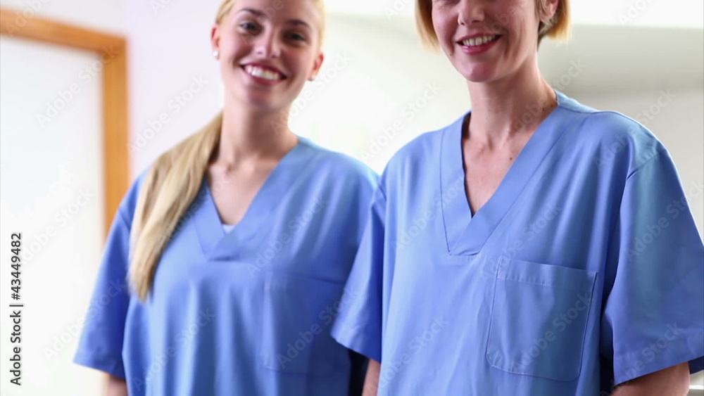Nurses looking at camera while smiling Nurses looking at camera while smiling