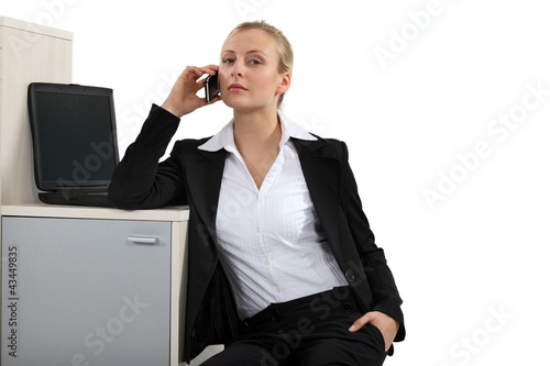Bilde på lerret Serious blond businesswoman making a call