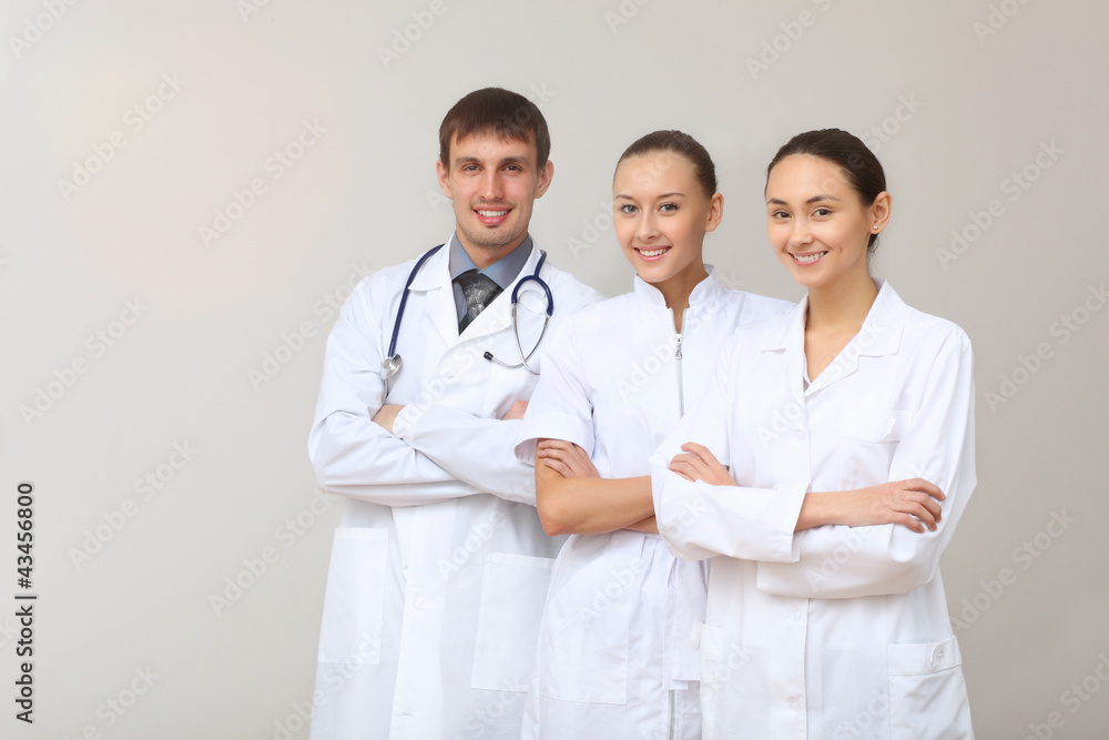 Three young doctor in white uniform Three young doctor in white uniform