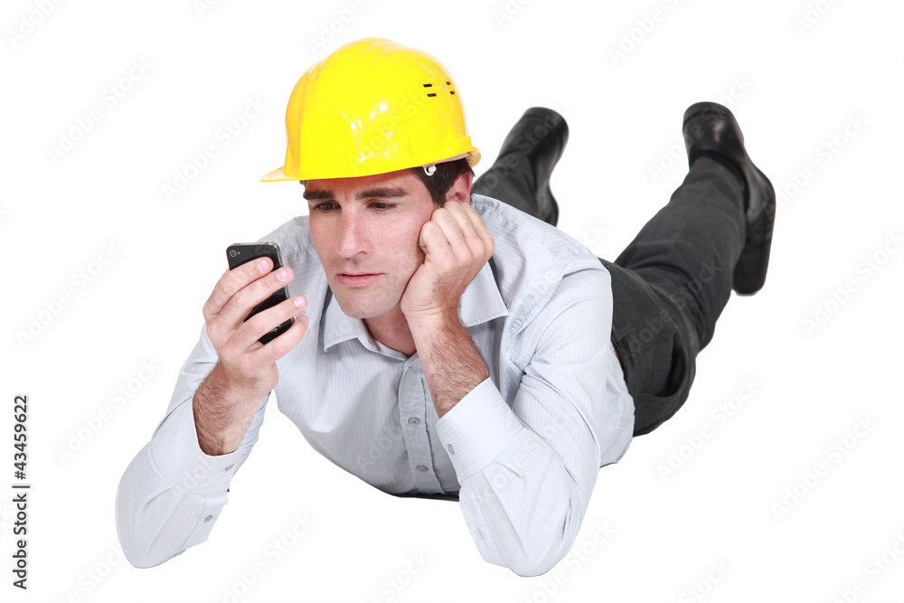 architect lying on floor looking annoyed at sms architect lying on floor looking annoyed at sms