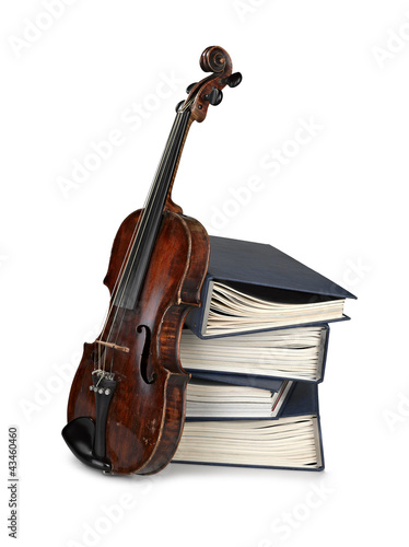 Old classical violin with books