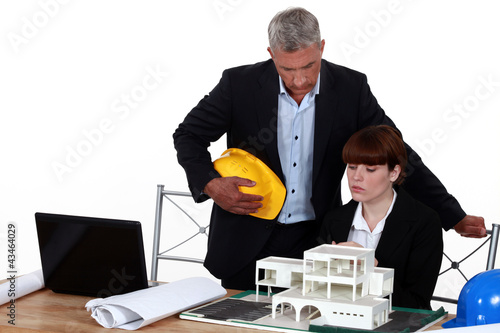 Experienced architect giving a young colleague advice photo