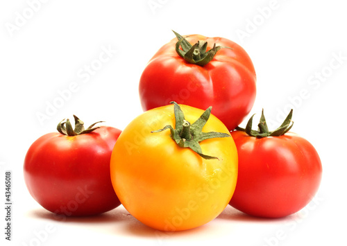 red and yellow tomatoes isolated on white