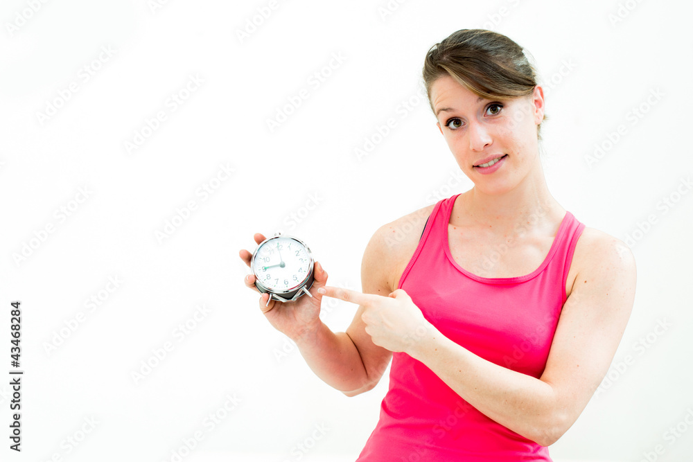 young beautiful woman holding a clock young beautiful woman holding a clock