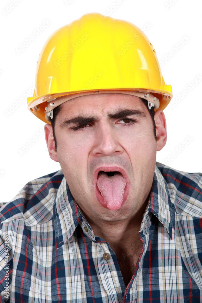 Construction worker with his tongue out