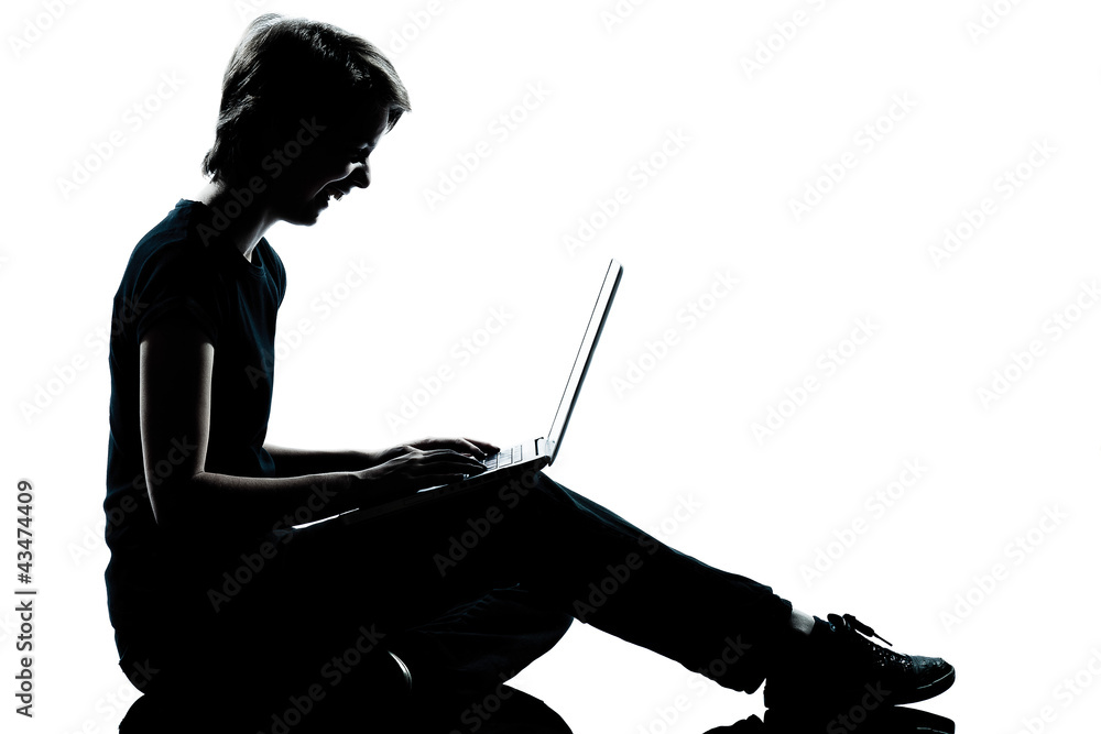 one young teenager boy or girl silhouette computer computing lap one young teenager boy or girl silhouette computer computing lap