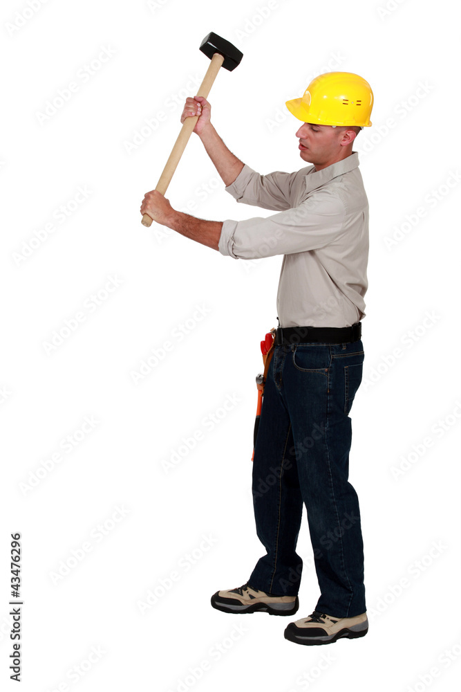 Workman using hammer, on white background Workman using hammer, on white background