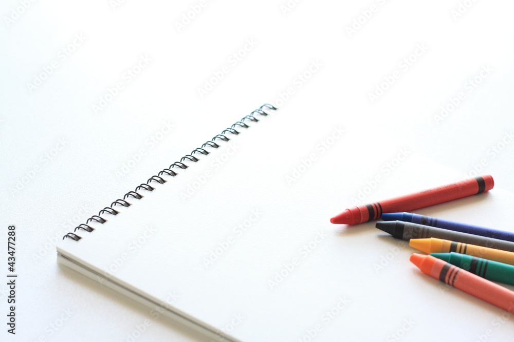 crayon and sketch book with copy space crayon and sketch book with copy space