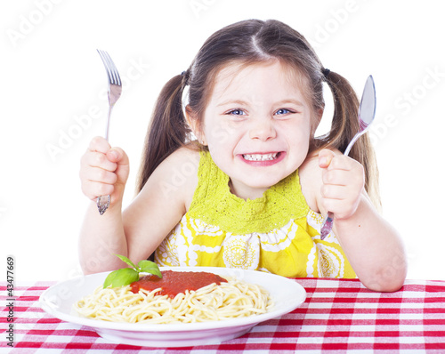 Beautiful girl eating pasta