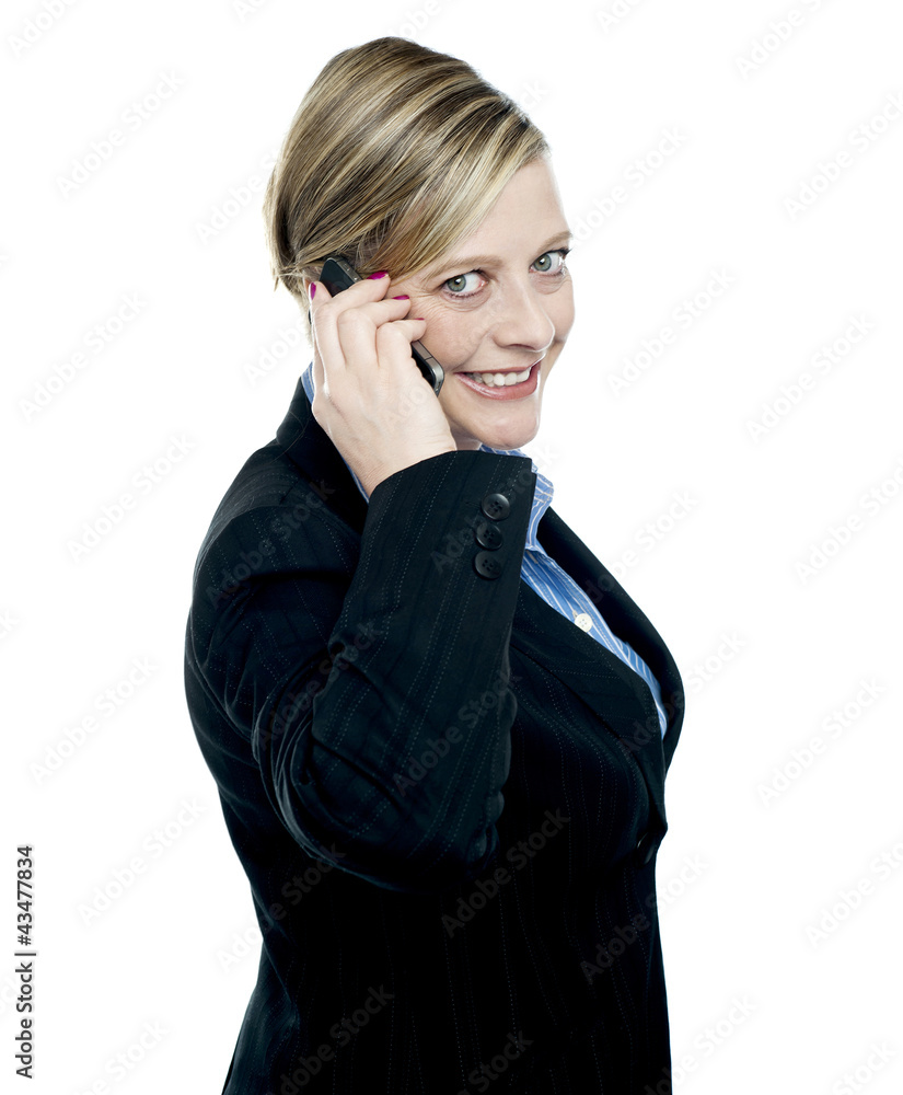 Portrait of business lady talking on mobile phone Portrait of business lady talking on mobile phone