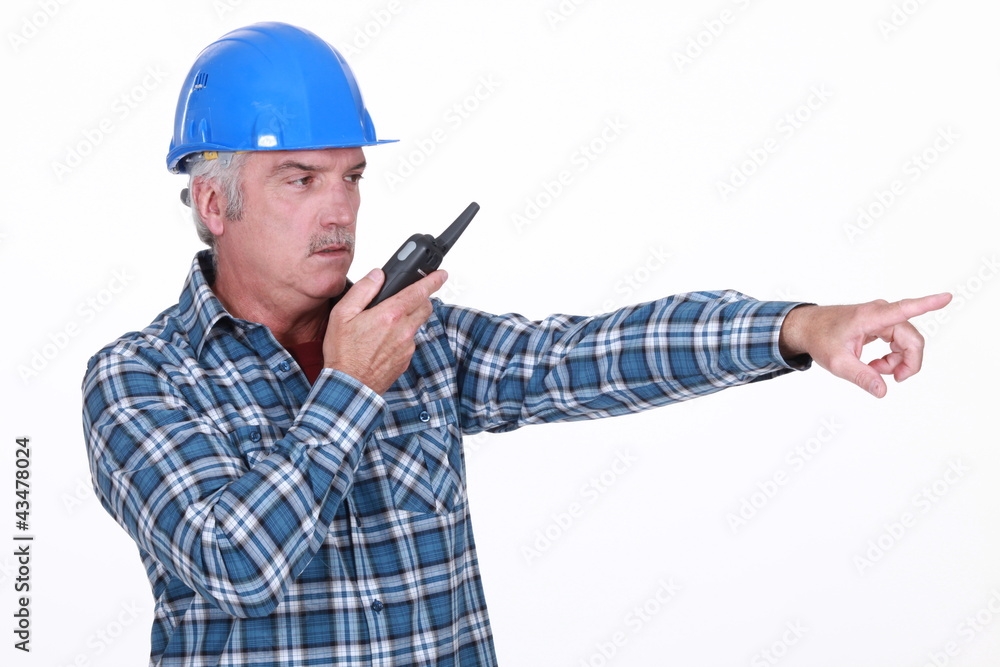 Foreman with radio pointing Foreman with radio pointing