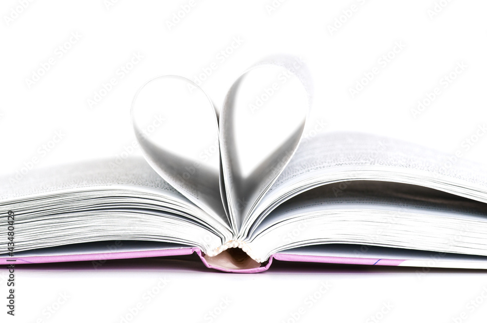 pages of a book curved into a heart shape pages of a book curved into a heart shape