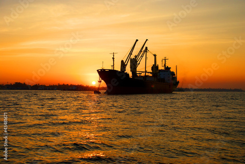 Fototapeta ship and sunset