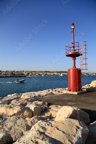 Fanale del porto di Marina di Ragusa. photo