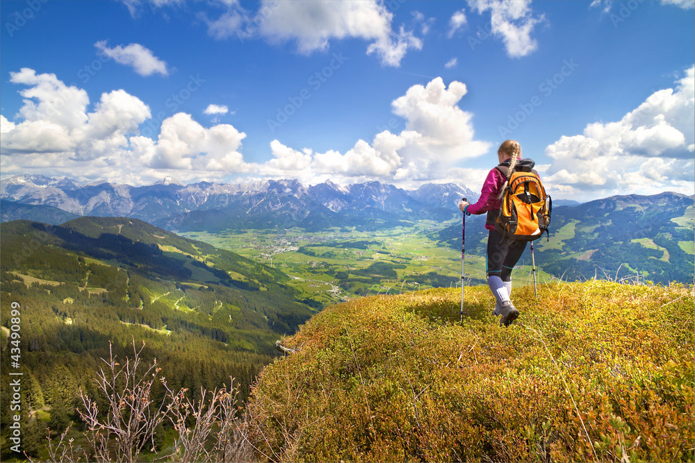 Young Woman hiking in the Mountains