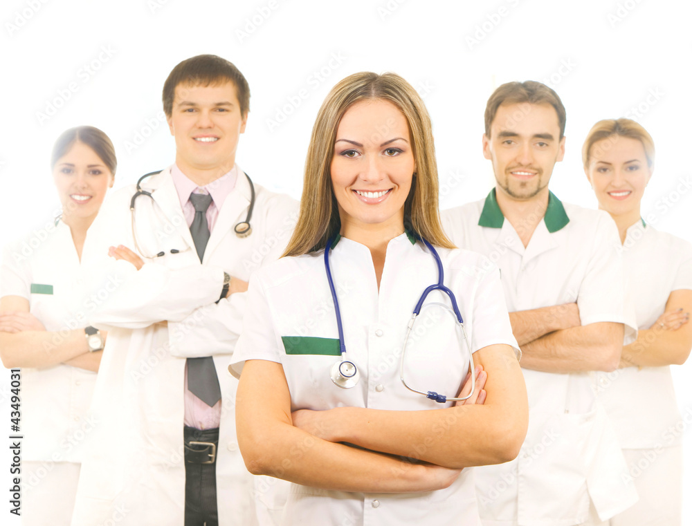 A team of young Caucasian medical workers in white clothes A team of young Caucasian medical workers in white clothes