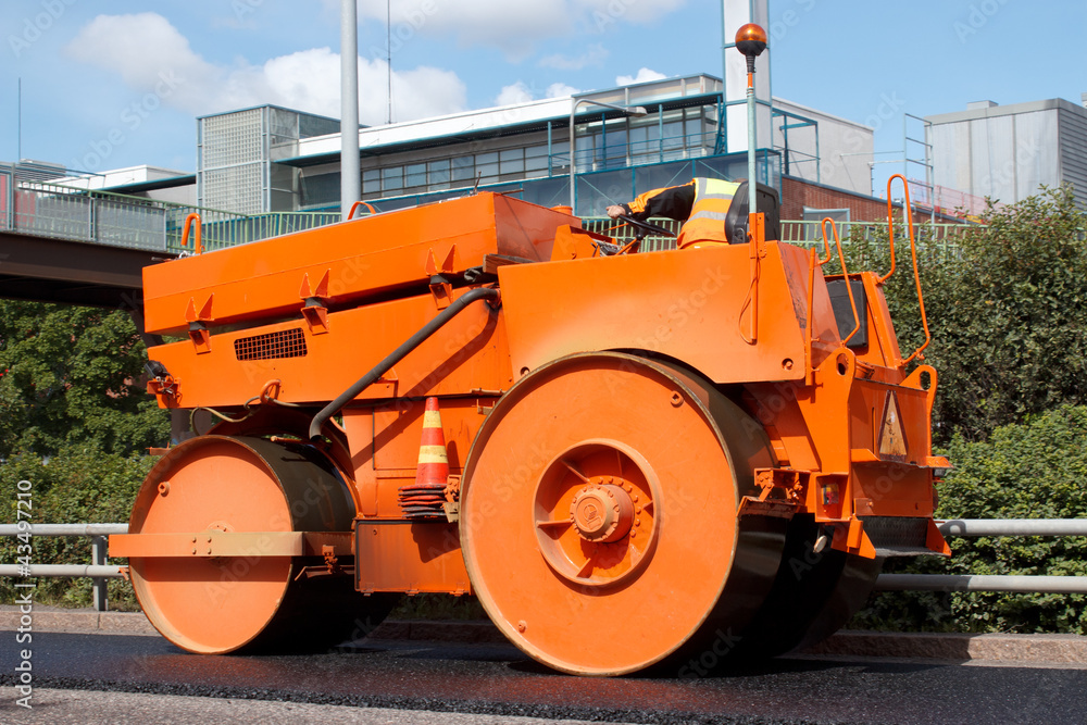 Asphalt roller in road construction site Asphalt roller in road construction site