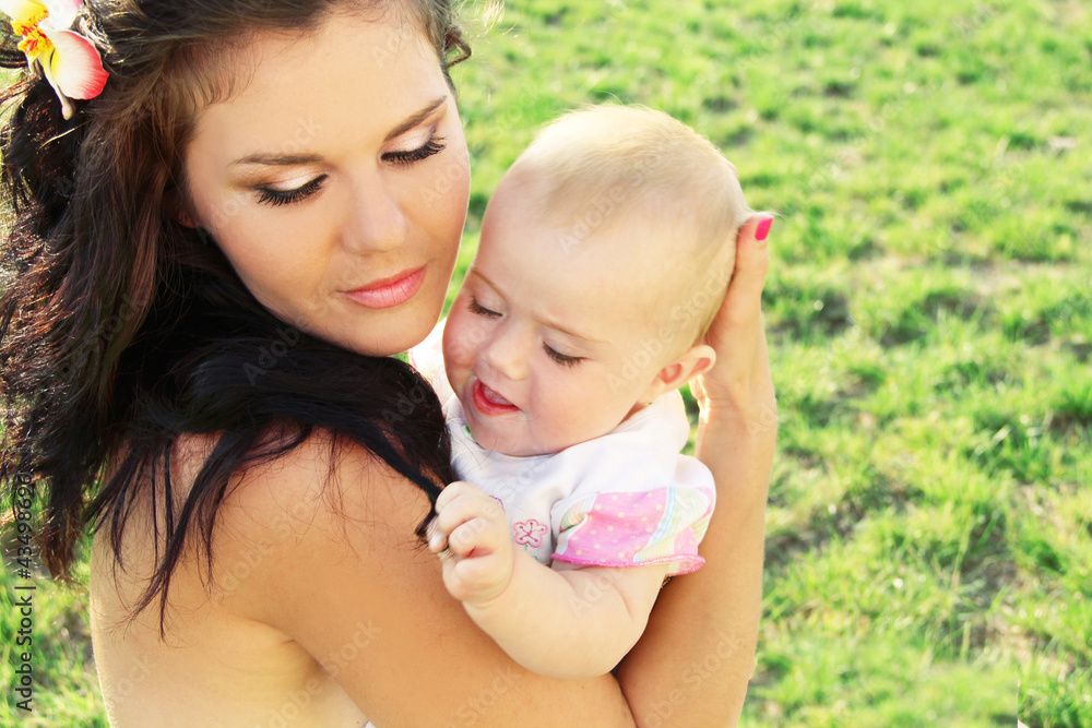 Beautiful mother with baby, outdoors portrait Beautiful mother with baby, outdoors portrait