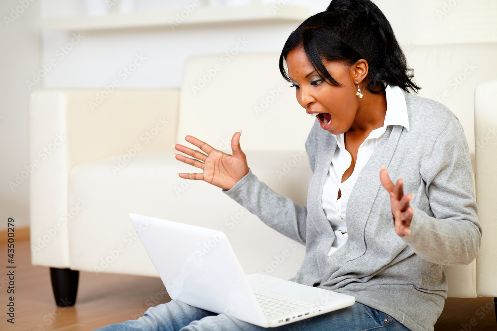 Surprised young woman browsing the Internet Surprised young woman browsing the Internet
